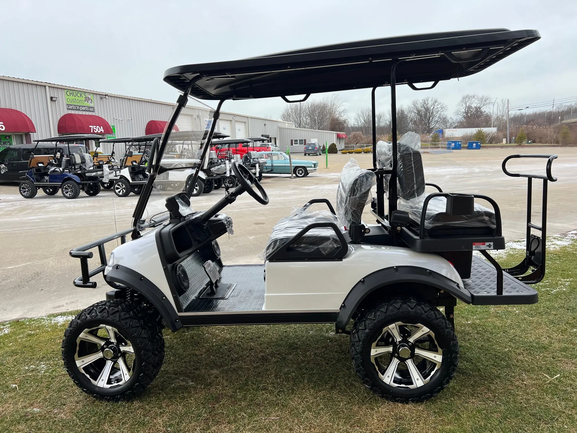 2025 Mineral White   Evolution Forester 4 Lithium Ion  Lifted Four Passenger